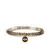 Gold & Diamond Eye Coin on Shaded Quartz