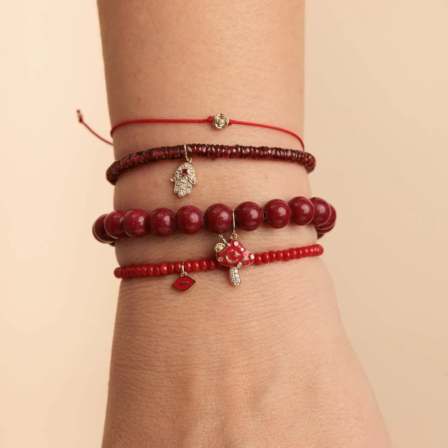 Gold & Diamond Hamsa on Garnet