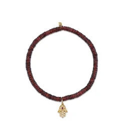 Gold & Diamond Hamsa on Garnet