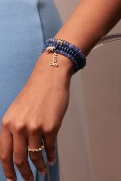 Gold & Diamond Surf Script on Tanzanite