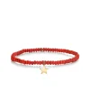 Pure Gold Tiny Star on Red Sea Bamboo